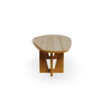 Side profile of the Alba dining table, emphasizing the clean lines of the iroko frame and the elegant thickness of the stone slab.