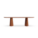 Frontal view of the Altea table, showcasing the elegant contrast between the handcrafted wooden legs and the natural stone surface.