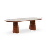 A direct look at the Altea dining table by Mediterrazza, where the warm tones of the iroko wood base support a smooth, rectangular travertine top.