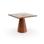 Cagliari dining table by Mediterrazza featuring a sculptural iroko wood conical base and a premium Aegean Rose marble top.