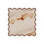 Top-down perspective of the Cagliari table, revealing the unique organic patterns and rich tones of the inlaid Aegean Rose marble surface.