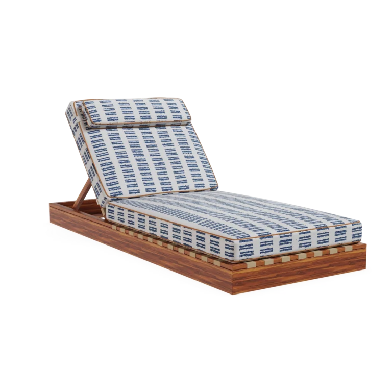 Front view of the Corsica sunbed by Mediterrazza in iroko wood, featuring patterned fabric cushions with refined piping detail.