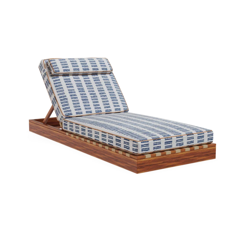 Front view of the Corsica sunbed by Mediterrazza in iroko wood, featuring patterned fabric cushions with refined piping detail.