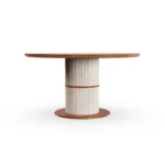 A direct look at the Escalet table, showcasing the monochromatic elegance of the natural stone and its architectural, textured pedestal.