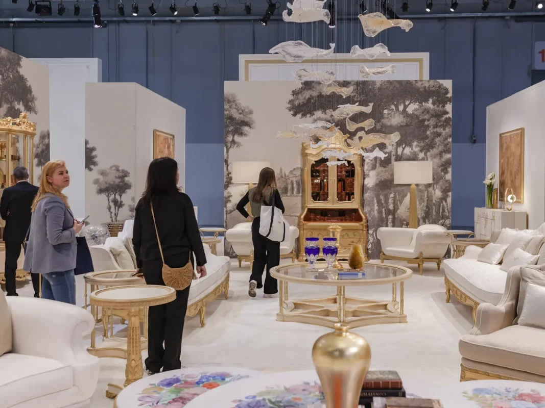 visitors exploring design booths and exhibits at an international furniture fair