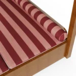 Close-up of the Paraggi sunbed by Mediterrazza, focusing on the texture and playful pattern of the striped outdoor fabric and its artisanal stitching.