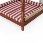 Detailed side view of the Paraggi sunbed by Mediterrazza, highlighting the intricate synthetic cord weaving on the armrests and the wood's grain.