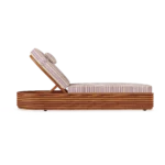 Side silhouette of the Paros lounger, showcasing the rhythmic ribbed texture of the base and the thick, comfortable seating.