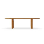 A forward view of the Rome table, highlighting the elegant oval silhouette and the architectural strength of its wooden pedestal.