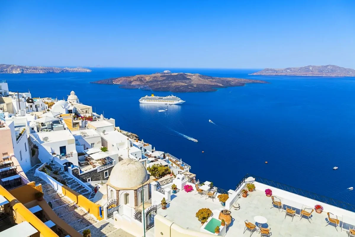 View of Santorini, a destination with iconic whitewashed architecture, breathtaking caldera views, and a vibrant Mediterranean lifestyle.
