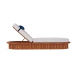 Side profile of the Sóller sunbed, illustrating the low-slung architectural silhouette and the decorative bolster cushion.