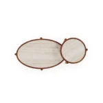 Trapani coffee table by Mediterrazza in travertine and iroko, a versatile duo with sculptural wood carving and Mediterranean charm.