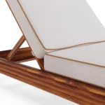 Close-up on the seating, emphasizing the precision of the piped edges and the rich texture of the outdoor-ready fabric.