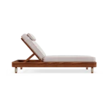 Side profile of the Valletta sunbed, illustrating the balanced proportions, the adjustable back, and the refined wooden frame.