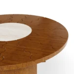 Volpe center table by Mediterrazza, a statement piece in iroko wood and travertine stone, blending artisanal craftsmanship and luxury design.