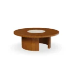 Volpe coffee table by Mediterrazza in iroko wood and travertine, featuring sculptural carved details inspired by Mediterranean sun rays.