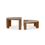 Benissa outdoor coffee table by Mediterrazza in ceramic and iroko, circular sculptural piece with refined artisanal precision.