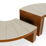 Benissa coffee table by Mediterrazza in iroko wood, circular modular table with a ceramic surface and organic, sculptural presence.