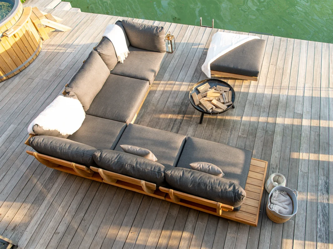 Overview of a poolside patio with a grey couch