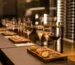 Luxury wine tasting experience with gourmet food pairings served on elegant wooden trays.