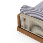 Close-up of the back of the Pardigon sunbed by Mediterrazza, focusing on the texture of the handcrafted woven cord and the natural grain of the iroko wood.