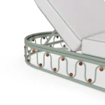 Close-up on the Toulon seating, emphasizing the plush, rounded silhouette of the upholstery and its refined finish.