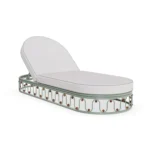 Toulon sunbed by Mediterrazza in lacquered metal, featuring a wave-like sculptural base and soft, rounded cushions.