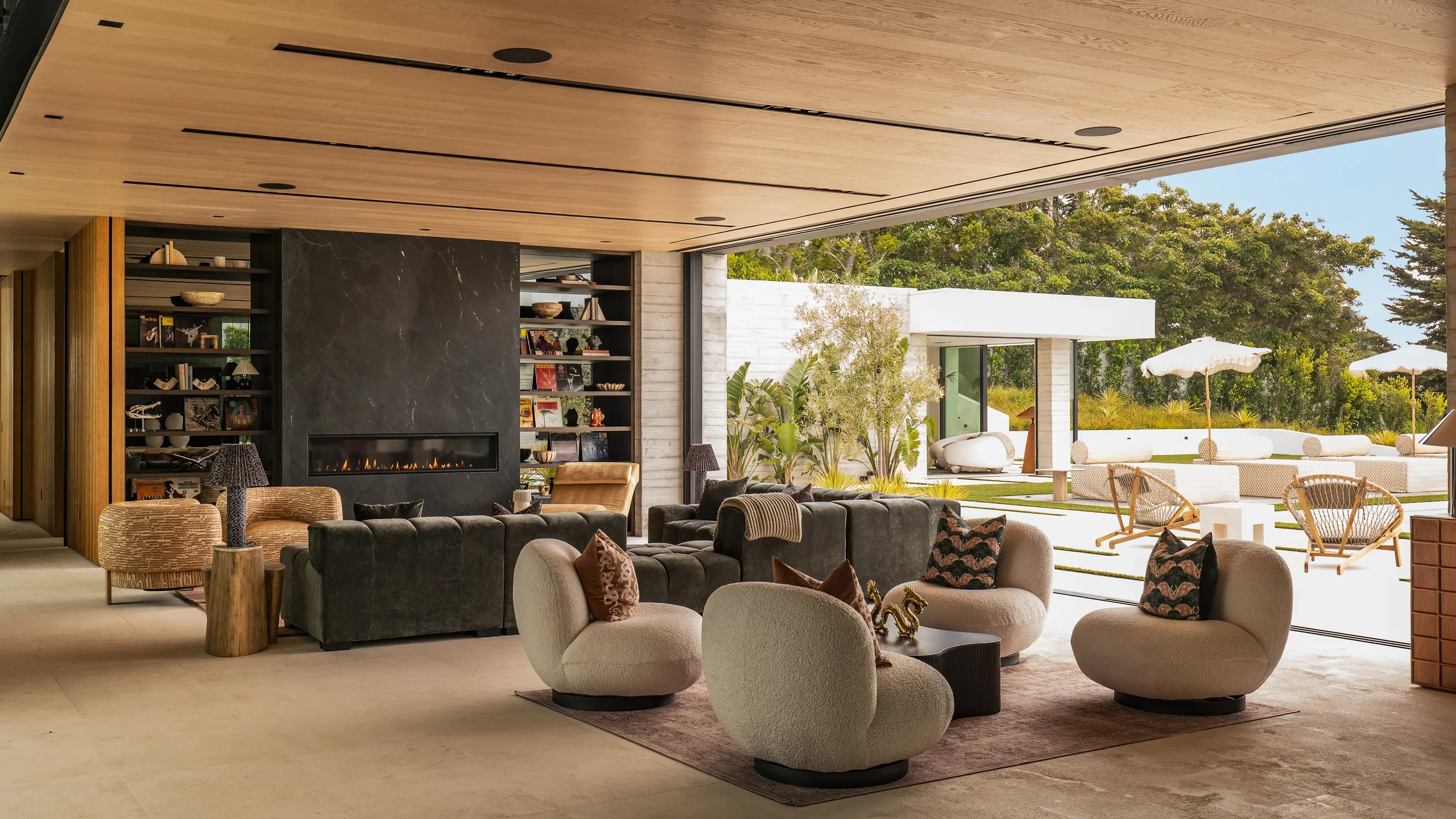 Contemporary coastal living space with seamless indoor-outdoor architecture, combining natural textures, open façades, and landscaped terraces.