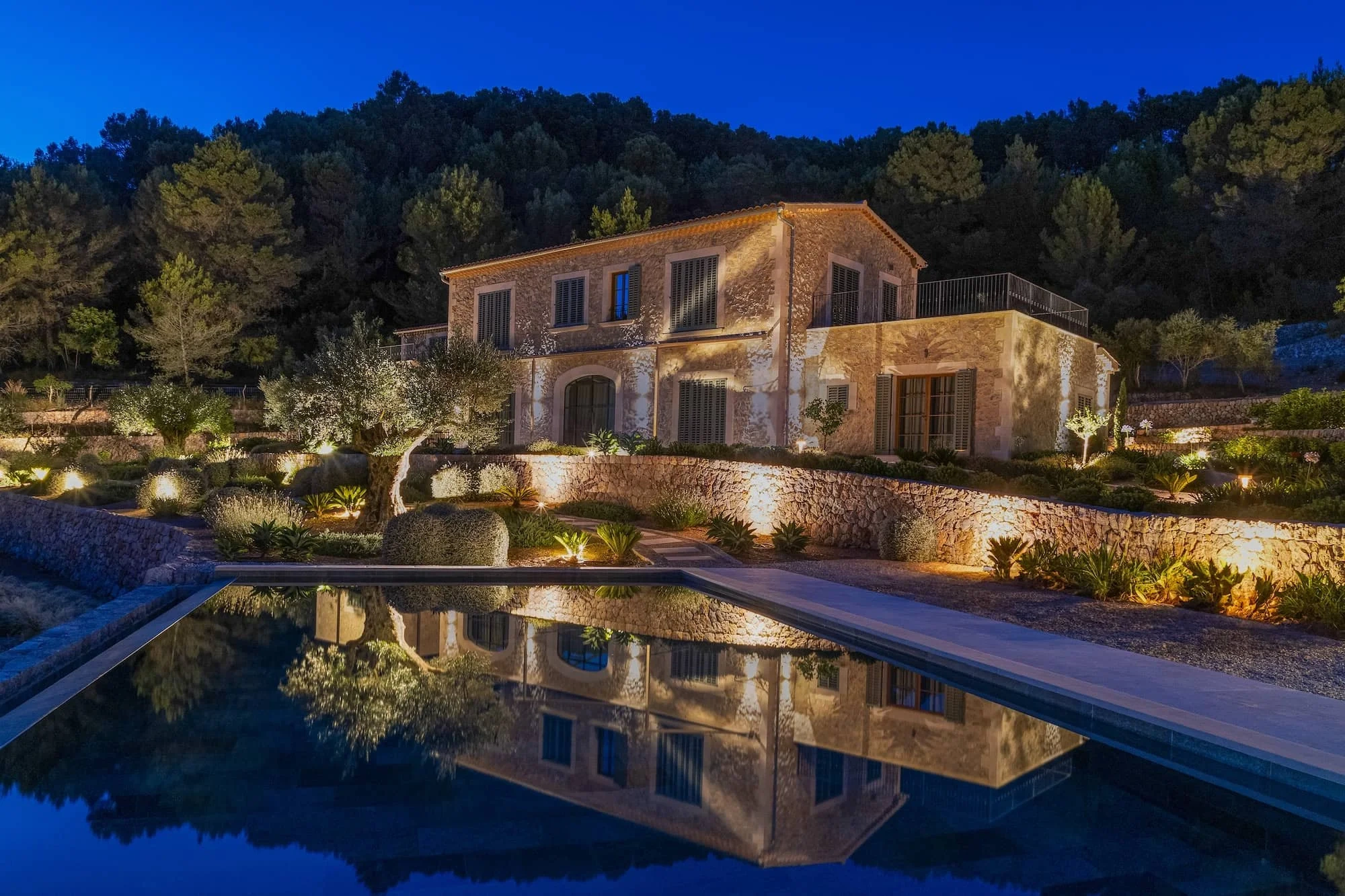 Luxury Mediterranean villa showcasing refined outdoor living, with contemporary outdoor furniture, expansive terraces, pools, and landscaped gardens designed for elegant villa life in Marbella.