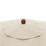 Close-up of the Corinto parasol by Mediterrazza, highlighting the circular wood finial and textured weather-resistant textile canopy.