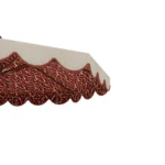 Close-up of the Elba parasol by Mediterrazza, highlighting the vibrant ikat-inspired interior pattern and handcrafted wood rib structure.