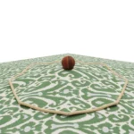 Close-up of the top of the Matera parasol, highlighting the textured white fabric and the smooth, rounded wooden finial.