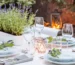 Luxury plant-to-plate outdoor dining experience featuring a refined outdoor dining area set beside a productive kitchen garden, architectural landscaping, and chef-prepared cuisine in an elegant residential setting.