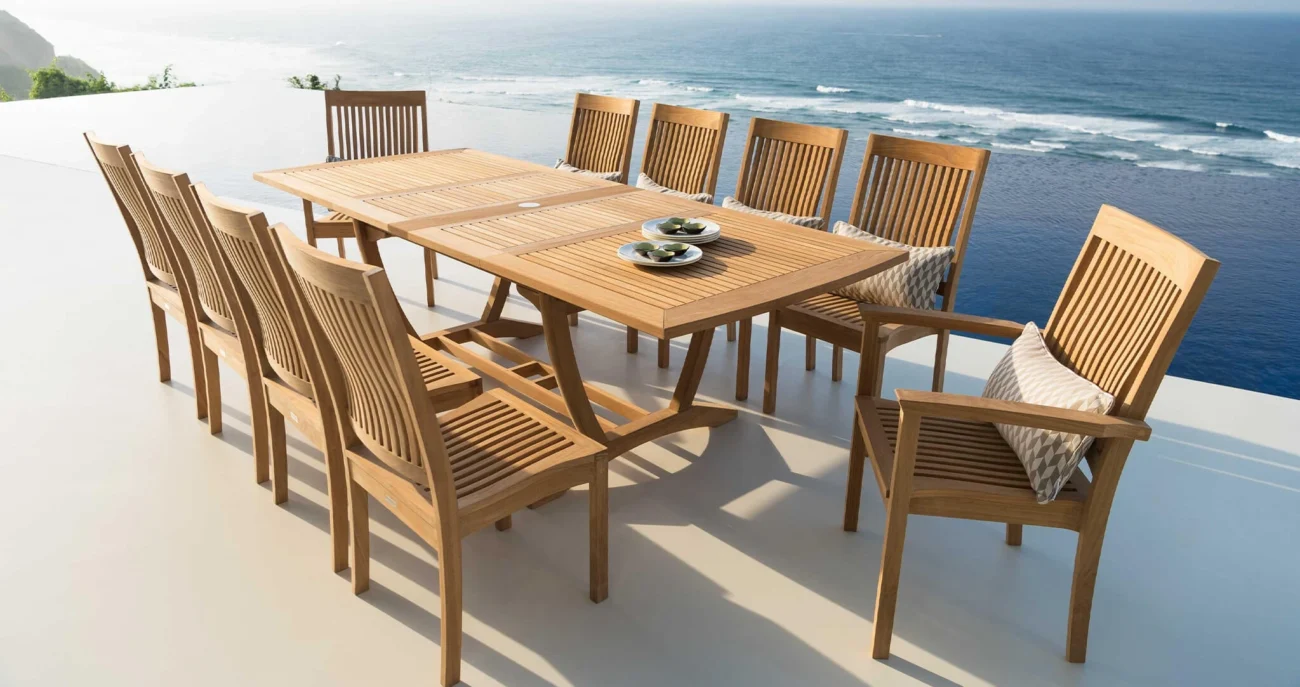 Luxury teak outdoor furniture including lounge seating, dining table, and sectional sofas styled on contemporary oceanfront terraces and poolside decks, showcasing natural wood tones and refined coastal architecture.