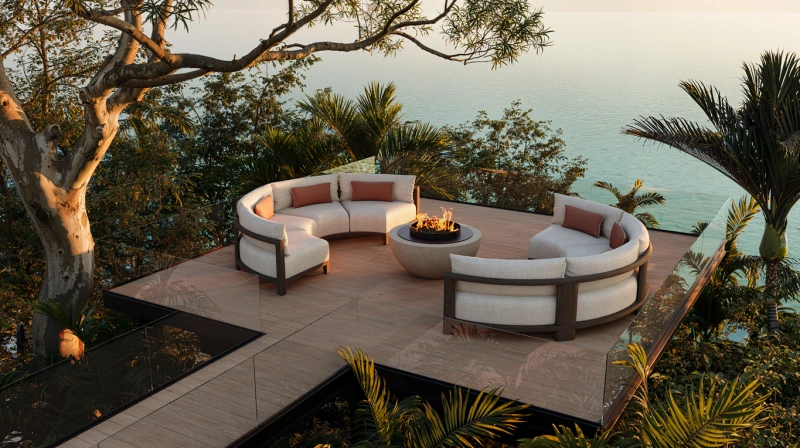 Sculptural contemporary outdoor furniture with soft, organic forms set within a refined natural landscape, expressing luxury outdoor living through fluid design, tactile materials, and seamless integration with architecture and greenery