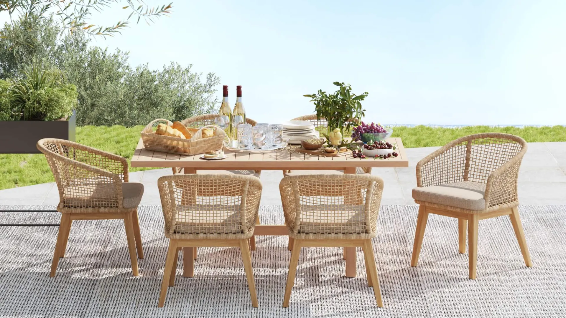 Luxury contemporary terrace featuring rope outdoor furniture with woven outdoor seating, sculptural lounge chairs, and modern patio design overlooking an architectural landscape.