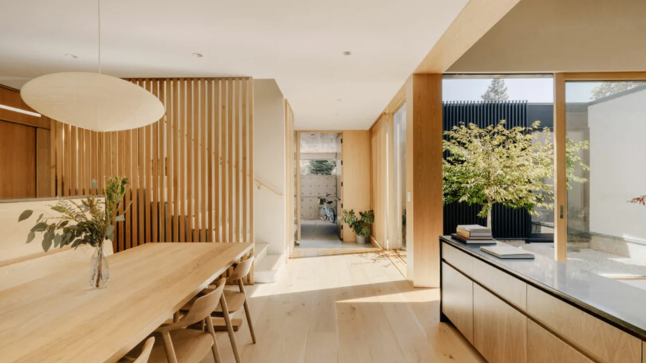 Japanese courtyard house showcasing traditional Japanese architecture with minimalist interiors, sliding shoji screens, wooden engawa veranda, and a serene Zen garden courtyard open to nature.
