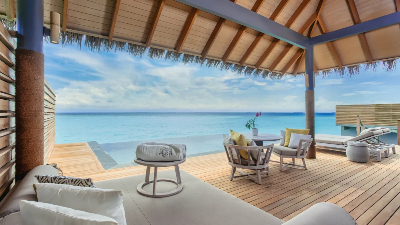 Maldives Island Resorts with luxury overwater bungalow architecture and outdoor lounging terraces above turquoise lagoons