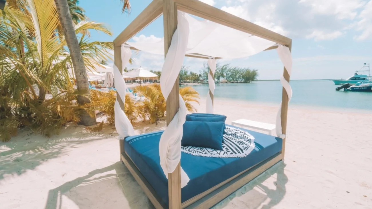 Luxury outdoor daybeds on Mediterranean terraces and Caribbean beachfront villas showcasing high-end outdoor living and contemporary coastal furniture design.