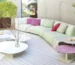 Colorful Paola Lenti luxury outdoor furniture on a Mediterranean terrace showcasing vibrant textiles, woven textures, and contemporary outdoor design.