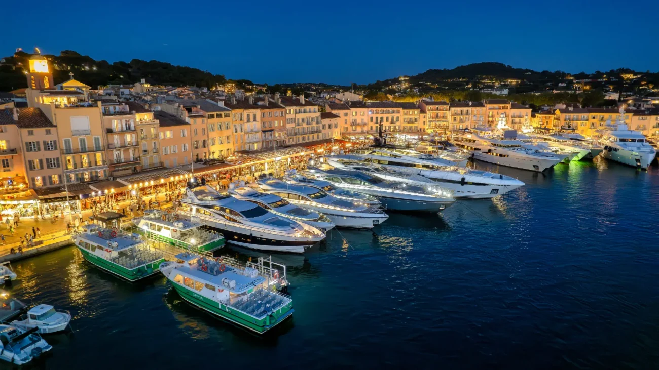 Elegant terraces in Saint-Tropez harbor apartments overlooking the Vieux Port with Mediterranean outdoor furniture and Riviera views.