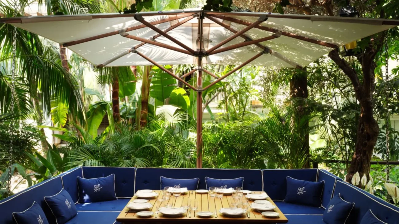 Luxury outdoor dining terrace at a Marbella beachfront restaurant showcasing elegant Mediterranean design, sea views, and refined alfresco atmosphere.