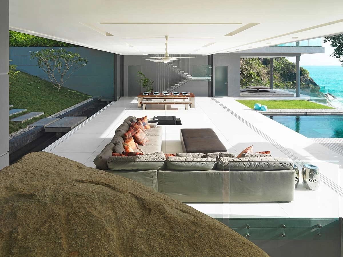 Living room at the Amanzi villa in Phuket, highlighting luxury design in coastal villas.