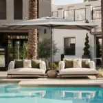 Mediterranean design fairs showcasing luxury outdoor lounge spaces with natural textures, contemporary furniture, and warm architectural lighting.
