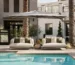 Mediterranean design fairs showcasing luxury outdoor lounge spaces with natural textures, contemporary furniture, and warm architectural lighting.