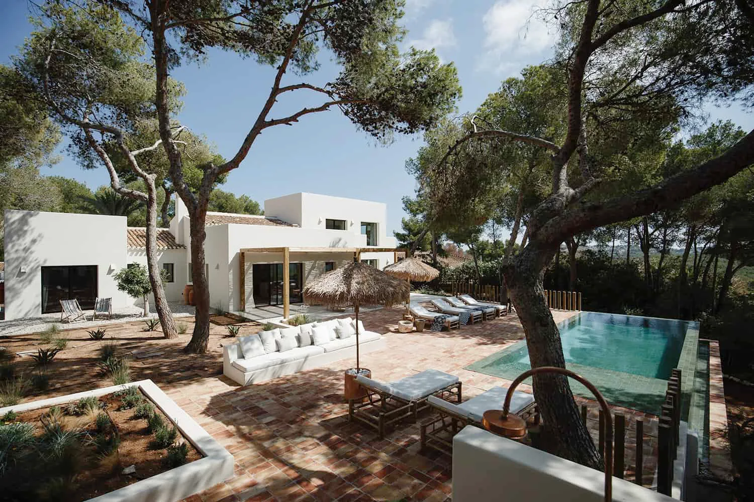 Seaside living architecture minimalist bioclimatic house in Spain with Mediterranean design, natural materials, sustainable structure, and panoramic coastal surroundings.