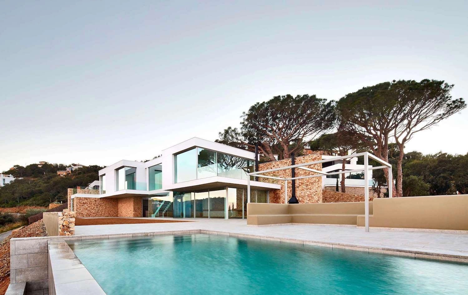 Seaside living architecture modern Mediterranean house on the Costa Brava with panoramic sea views, natural materials, and contemporary coastal design.