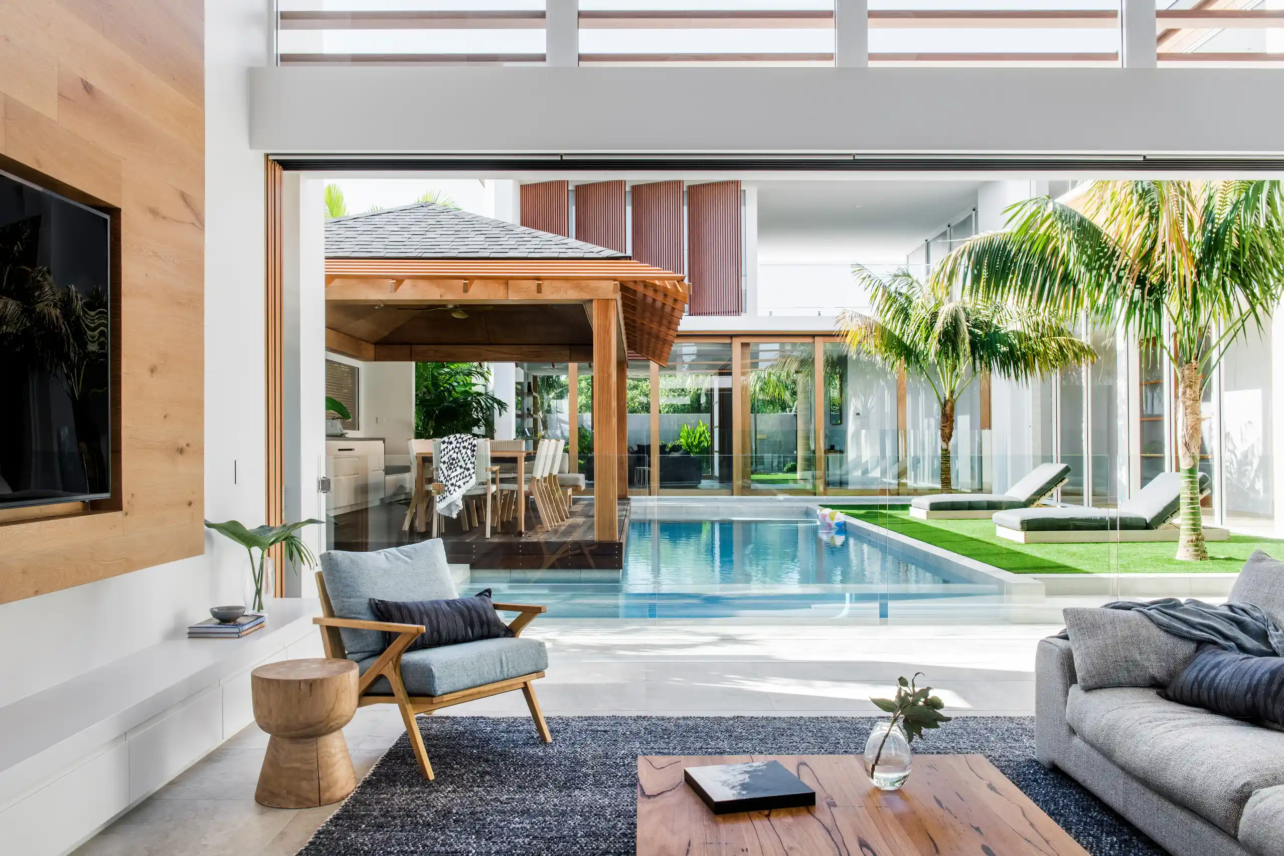 Luxury Coastal Real Estate featuring a contemporary interior with panoramic ocean views, natural materials, and sophisticated design.