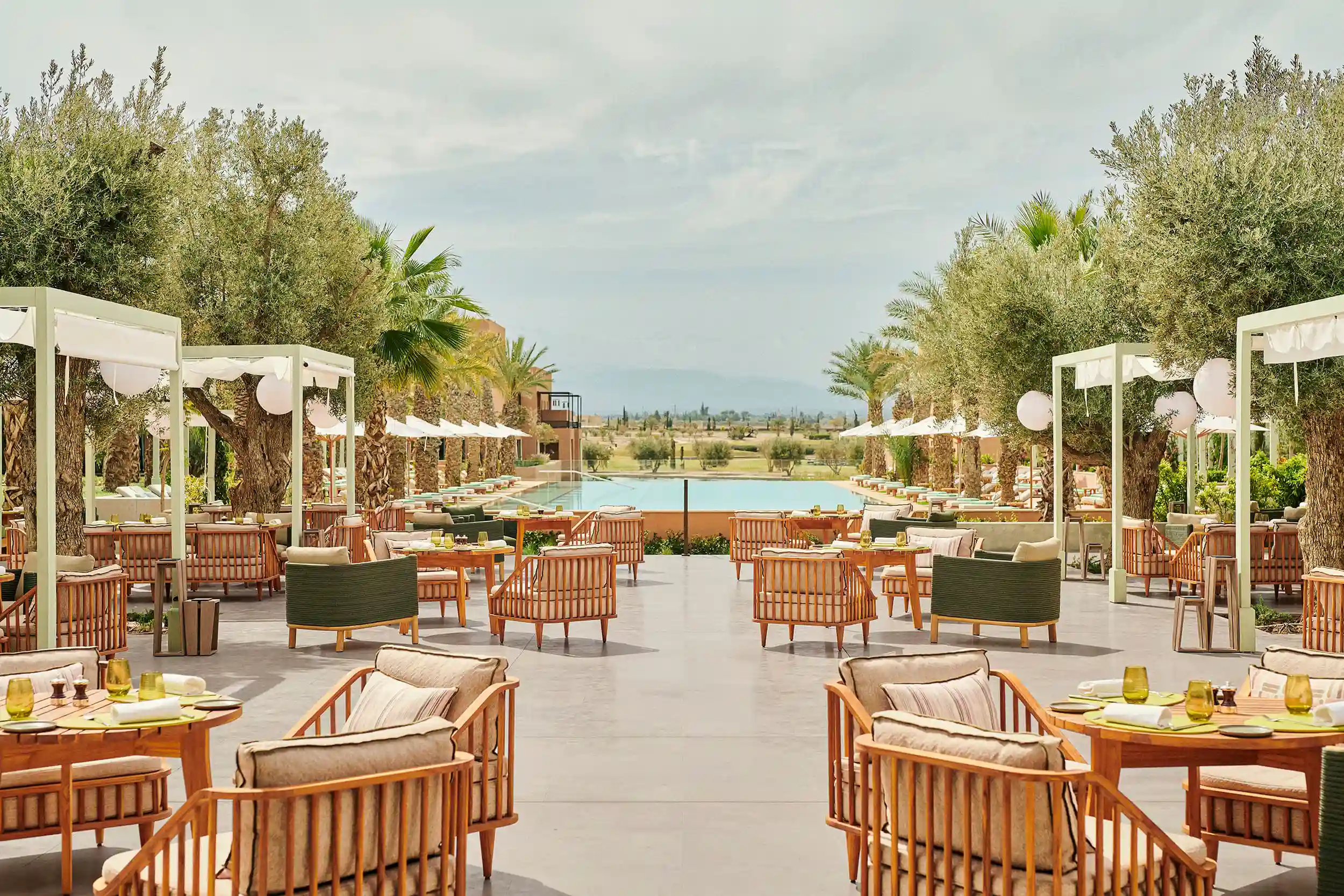 Mediterranean Travel Experiences highlighting outdoor dining, coastal hospitality, and the Mediterranean lifestyle through contemporary design.