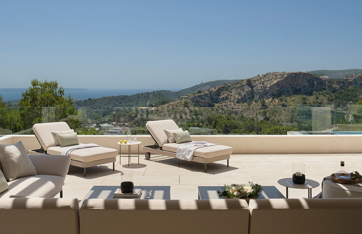 Outdoor Luxury Design showcasing an elegant Mediterranean dining terrace with natural materials, refined furniture, and contemporary outdoor living.